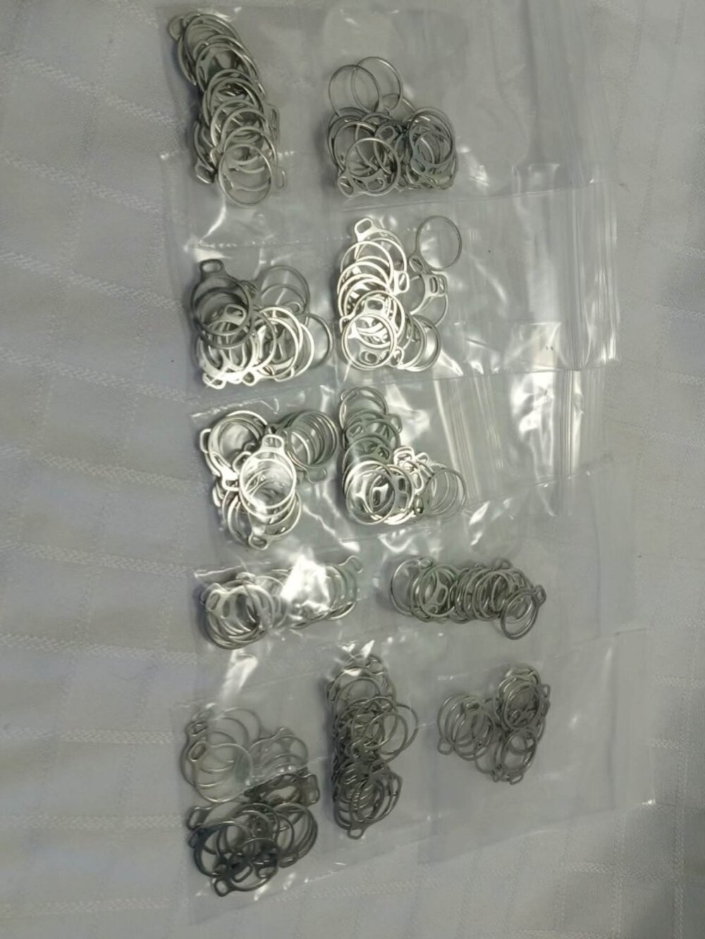 + 150 double connectors, stainless steel rings welded in an eight shape 0.3 mm t